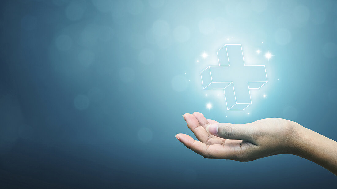 Neues aus der Berufspolitik Symboldarstellung: Hand hält Krankenhaussymbol